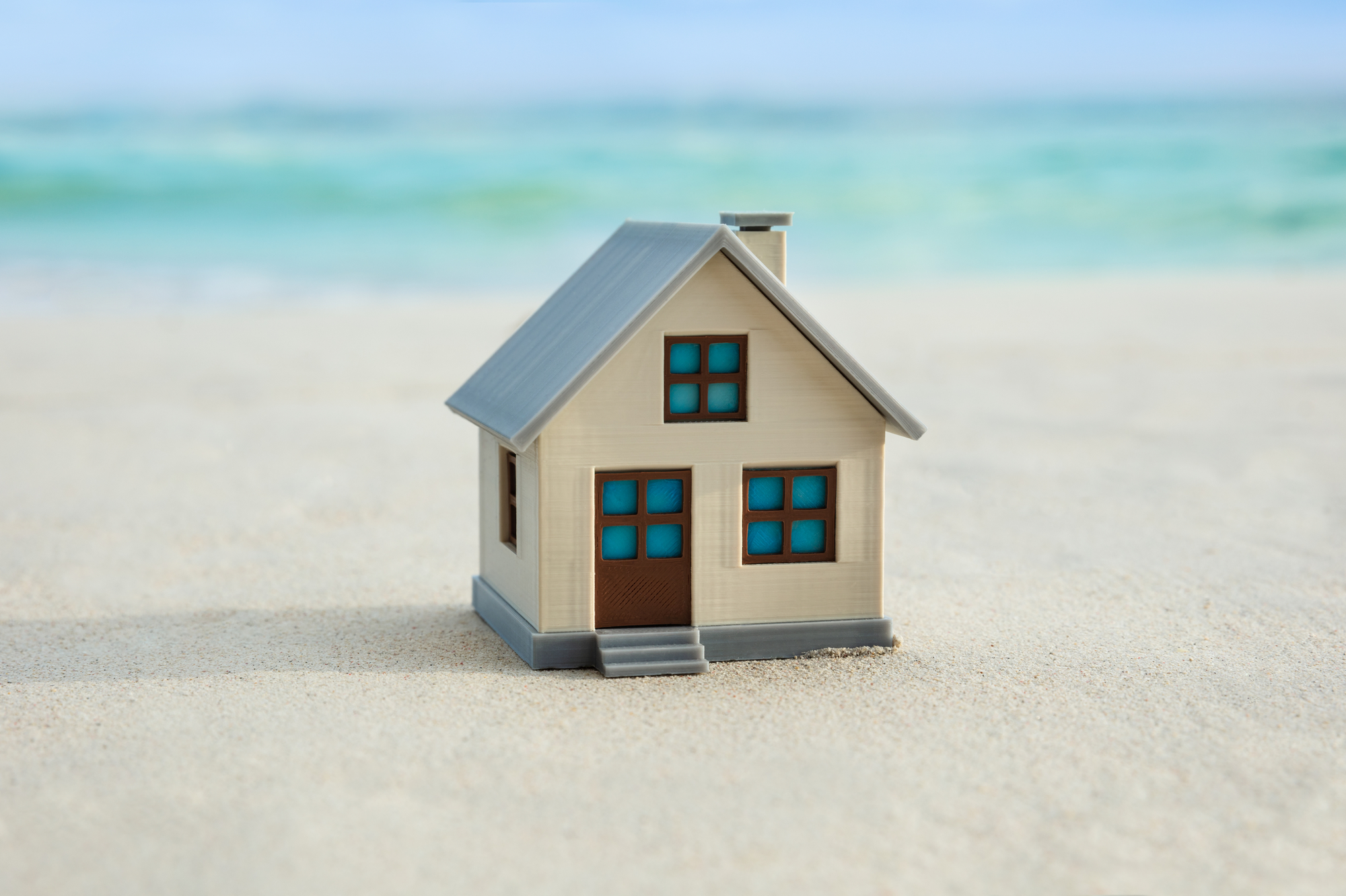 Why Young Adults Need Estate Plans - House Model On The Beach